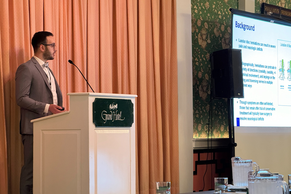 An image of an OUWB student speaking at the conference