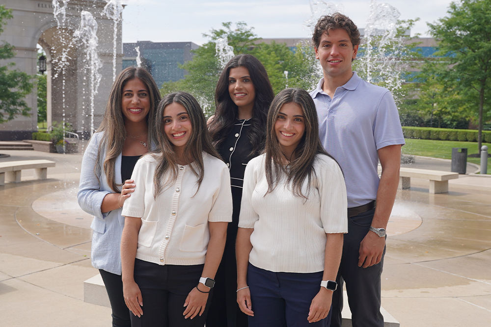 An image of five members of the Thomas family