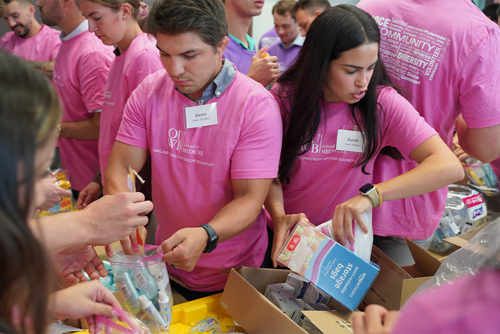 An image of students assembling care kits