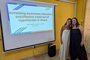 Sophia and Cassandra pose for a photo after their presentation