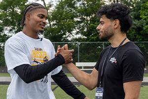 OUWB student Emaad Khan and Pittsburgh Steelers player Jaquan Brisker