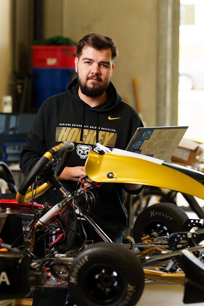 A person working on a race kart