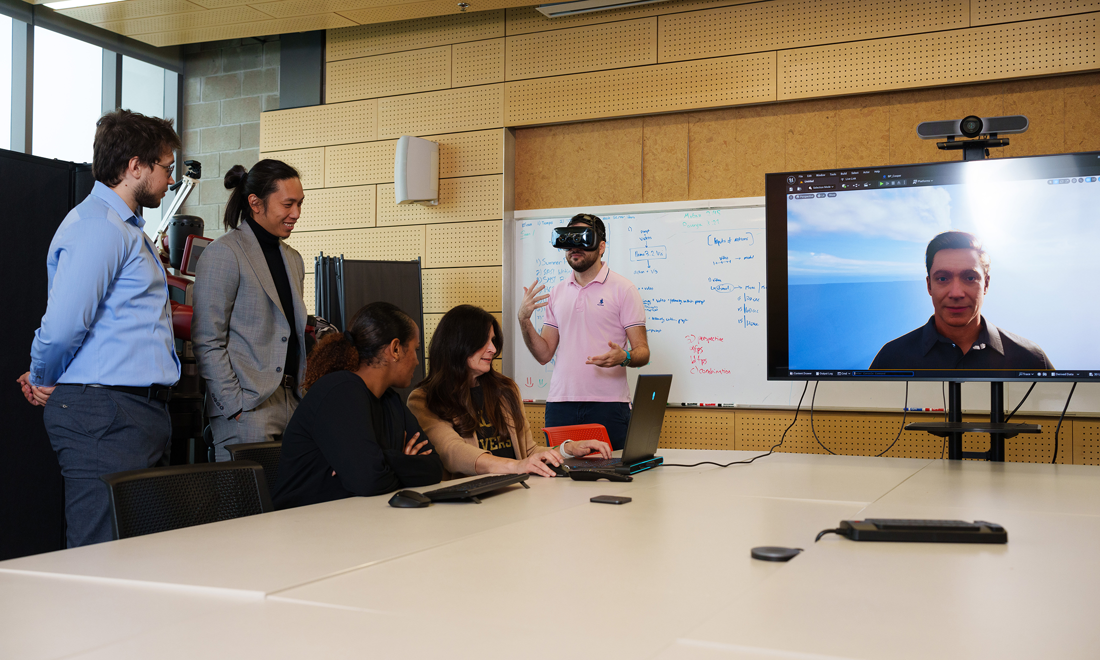 People working on augmented reality equipment