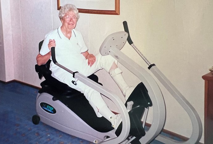 A woman using a NuStep Elliptical