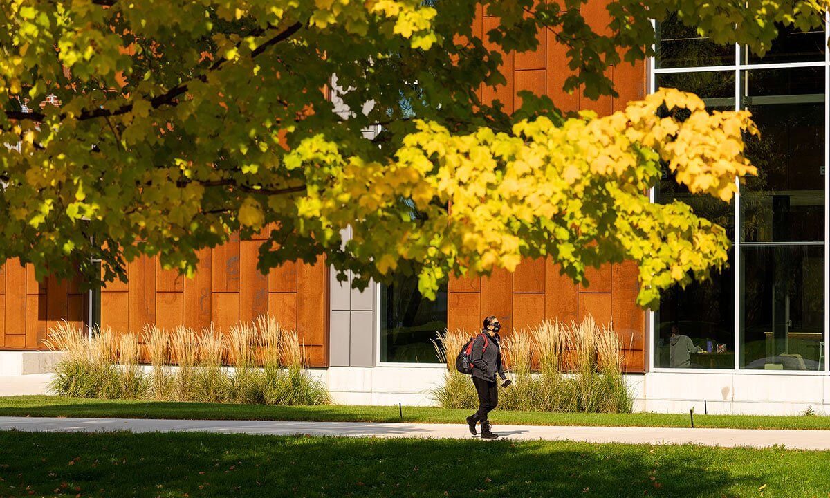 Student walking outside on campus