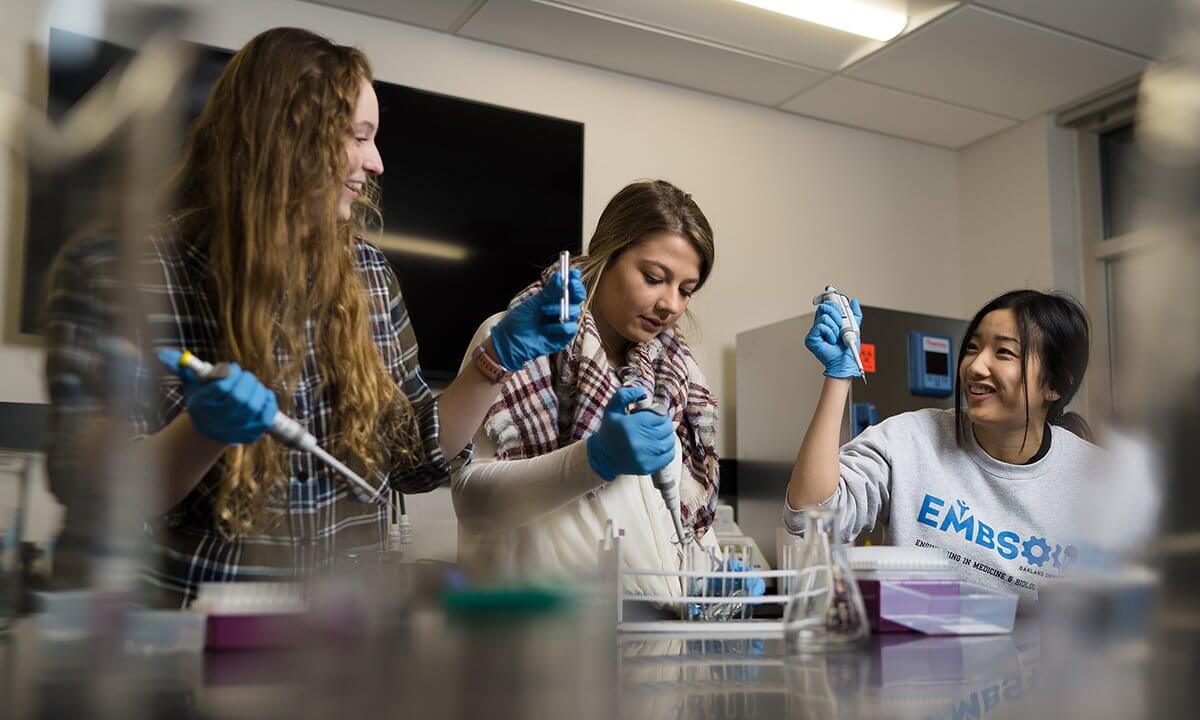 Three women in a lab.