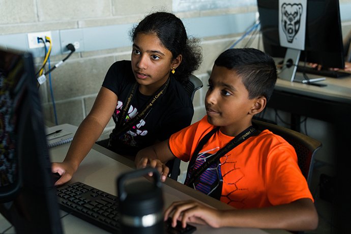 Image of Ava and Asher Wilson, 6th graders from Shelby Township, learning coding.