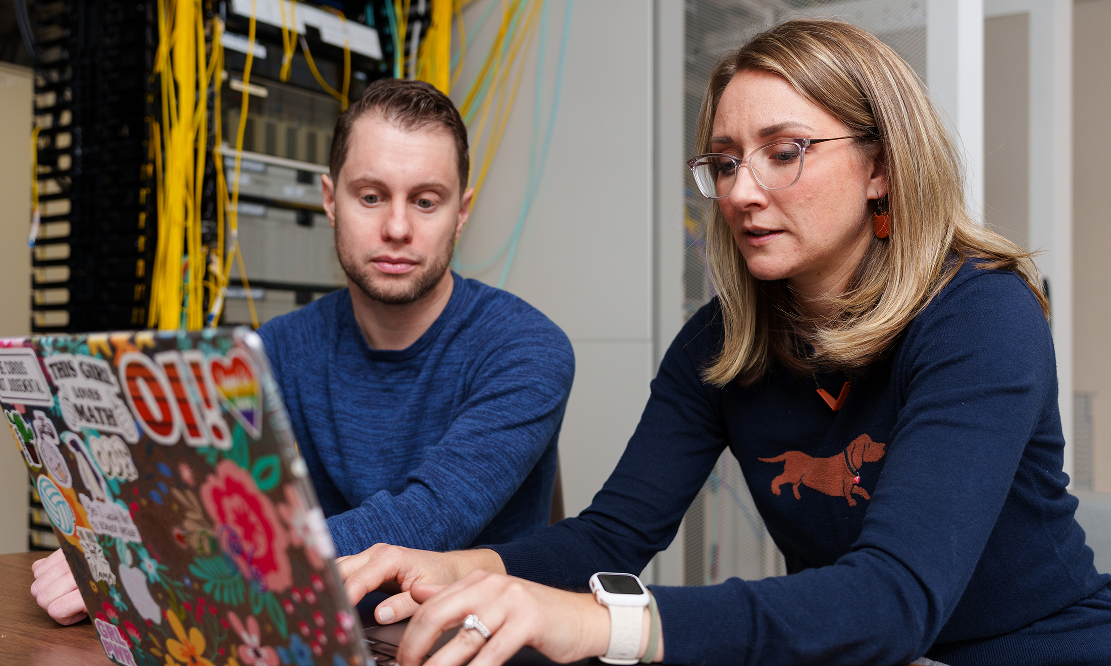 Two people working at a computer