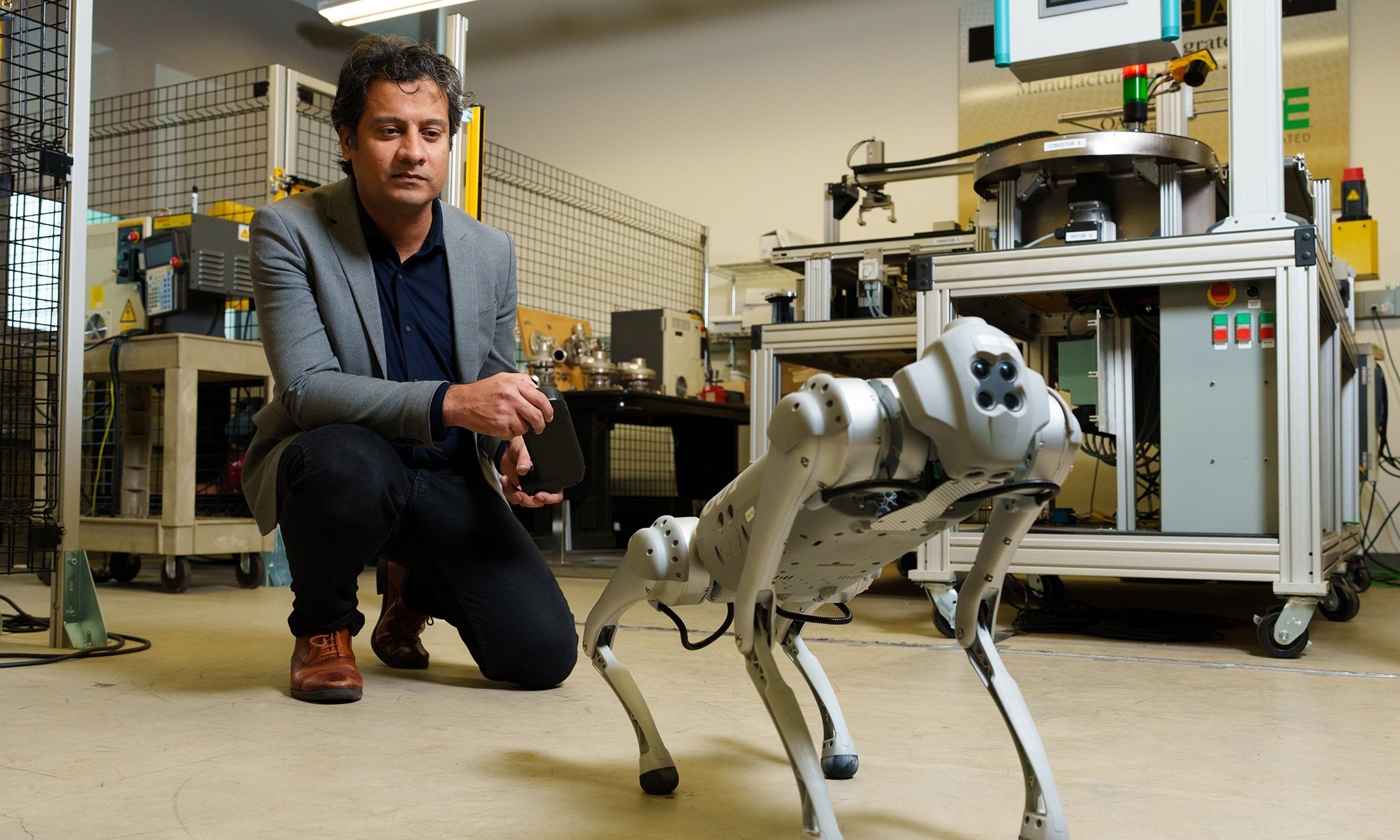 A man testing a four-legged robot