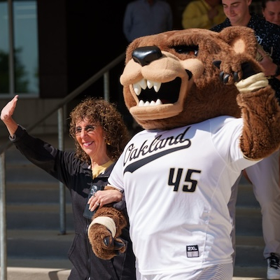President Ora Hirsch Pescovitz with the Grizz mascot