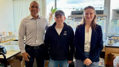 Three professors looking into the camera