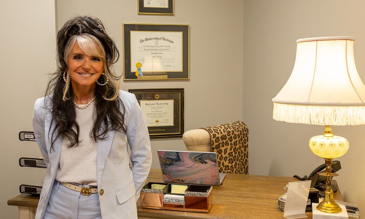 woman standing by desk