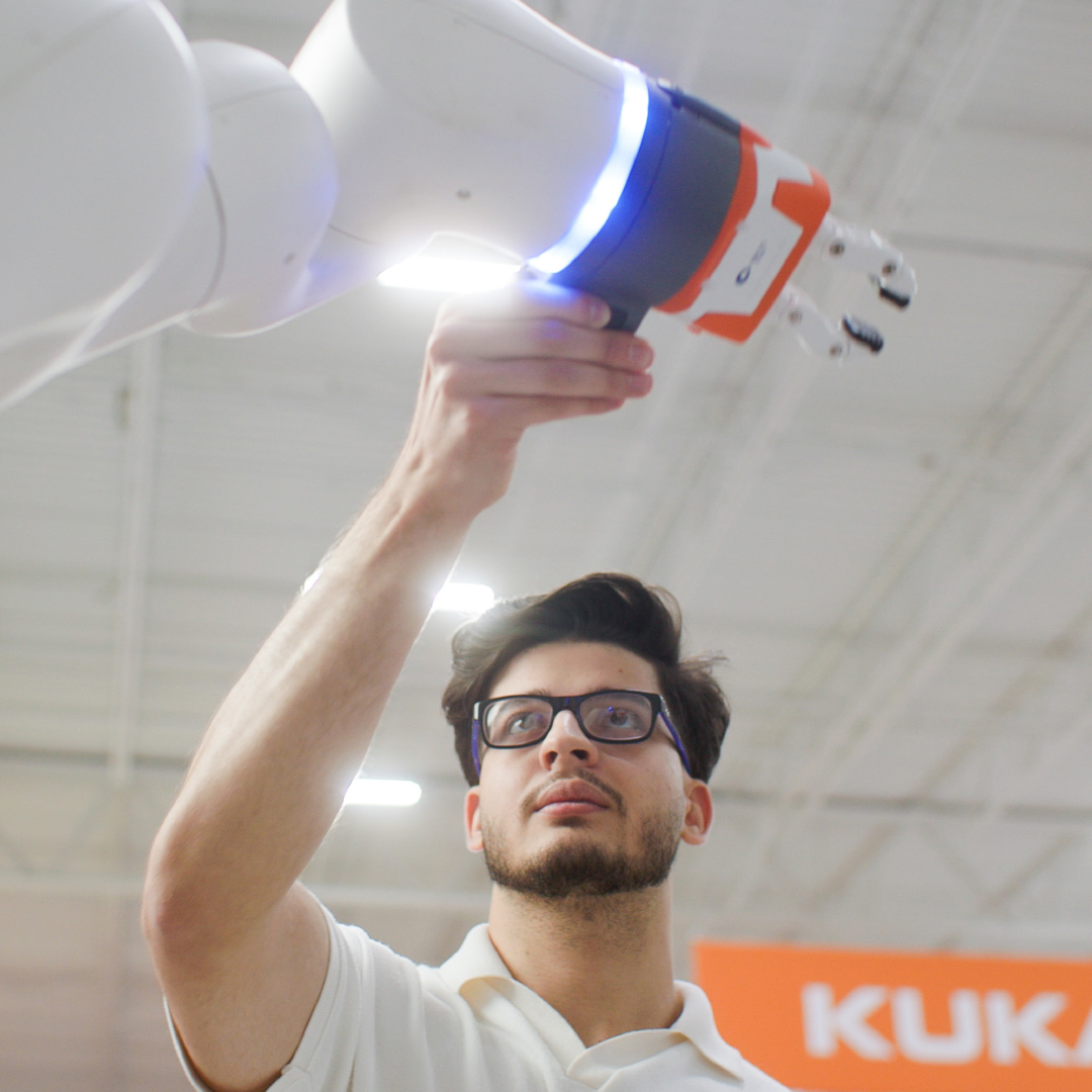 A man adjusting mechanical equipment