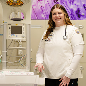 BSN student, Taylor, smiling for a photo in a medical office.