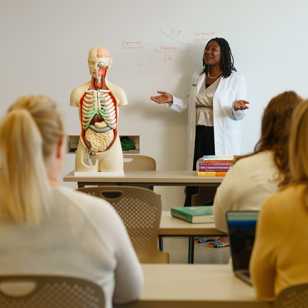 Oakland University graduate, Ashlee, teaching a medical class