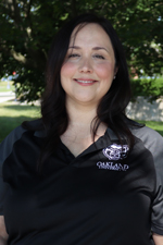 A professional headshot of Katrina Adrian in a black Oakland University shirt.