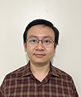 Treit Tran smiling at the camera
