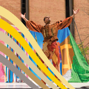 person with arms out standing and looking up